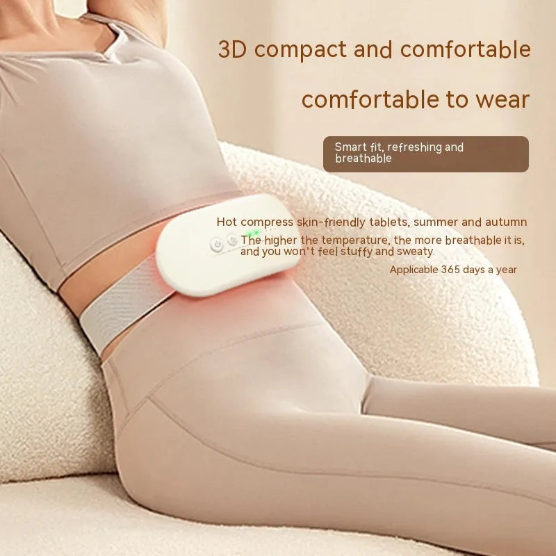 Battery-powered abdominal massager in creamy white with adapter cable and three colour options