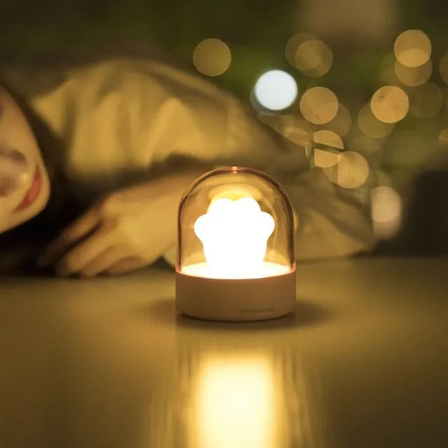 Pink cat paw shaped night light with USB charging cable and music box function