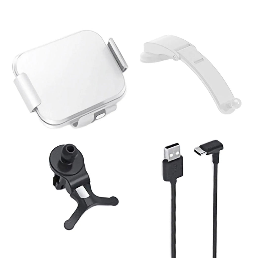Grey and white car wireless charging phone holder with vent clip and suction cup mount on a dashboard.