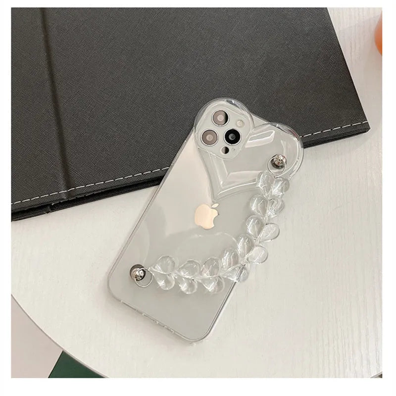 Transparent soft TPU iPhone case with a decorative silver love bracelet chain attached.
