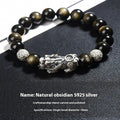 Men's geometric bracelet with a polished obsidian bead and 999 sterling silver on a leather strap.