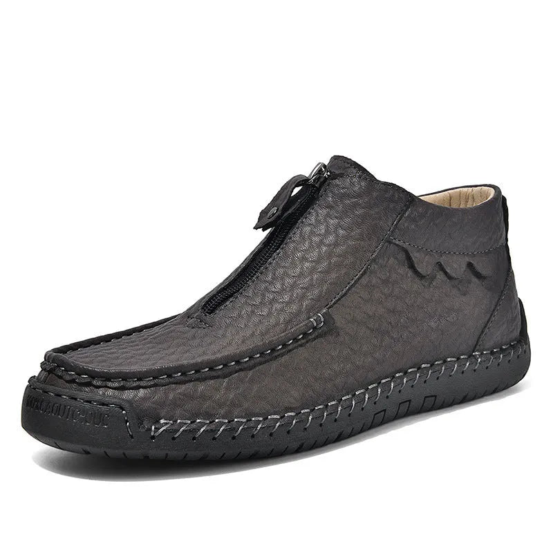 Men's black slip-on leather loafers with round toe and sewn sole detail on a white background.