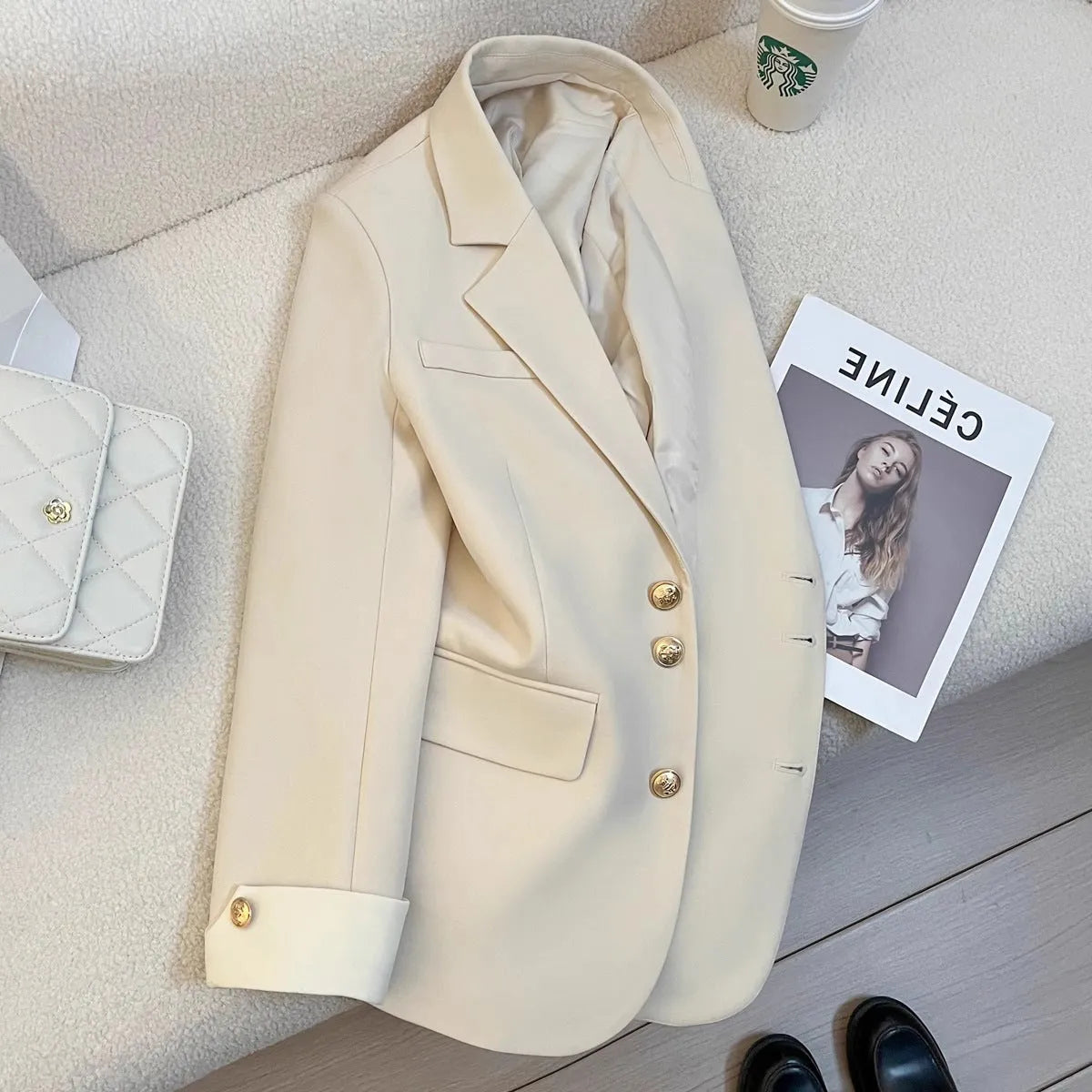 Korean style loose fit women's coat in milky white, showing front view with pockets.