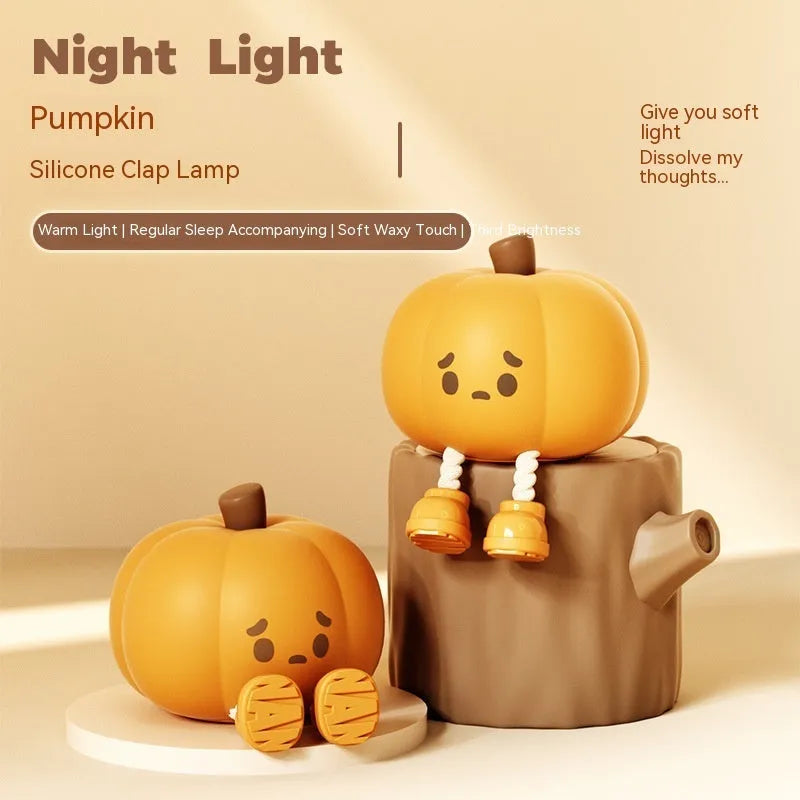 Orange pumpkin-shaped silicone night light with soft glowing illumination