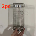 Stainless steel cylindrical rolling barbecue basket with wire mesh for grilling vegetables and meat.