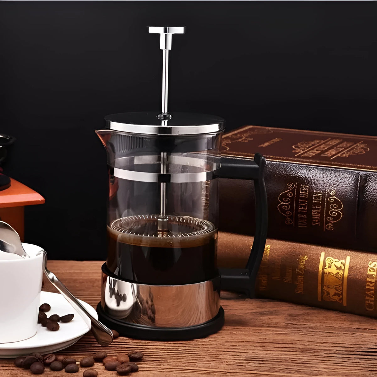 Compact glass and stainless steel manual pour-over coffee maker with 350ml capacity.