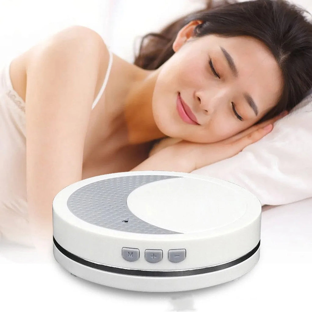 White ABS plastic sleep aid instrument with USB connector showing timer and music functions