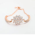 Rose gold cubic zirconia bracelet for women with adjustable 13-19cm length and cross, crown or Roman numeral design.