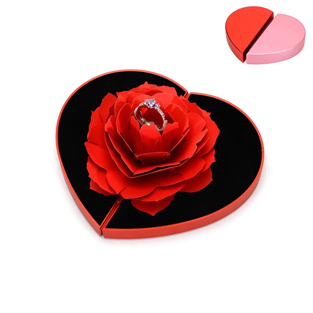 Red 3D heart-shaped plastic ring box with a rotating white rose decoration on top.