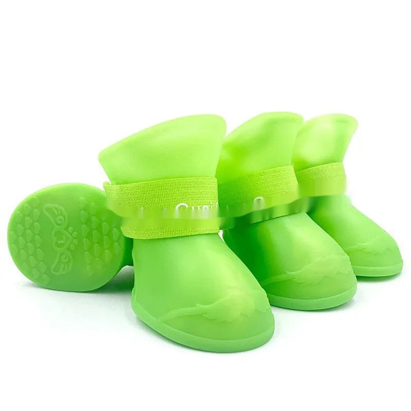 Set of four colourful rubber pet rain shoes with soft soles for dogs or cats.