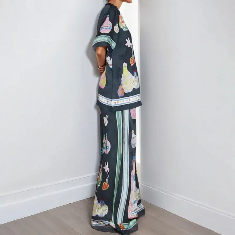 Black women's casual set with cartoon print, featuring a sleeve cardigan and trousers
