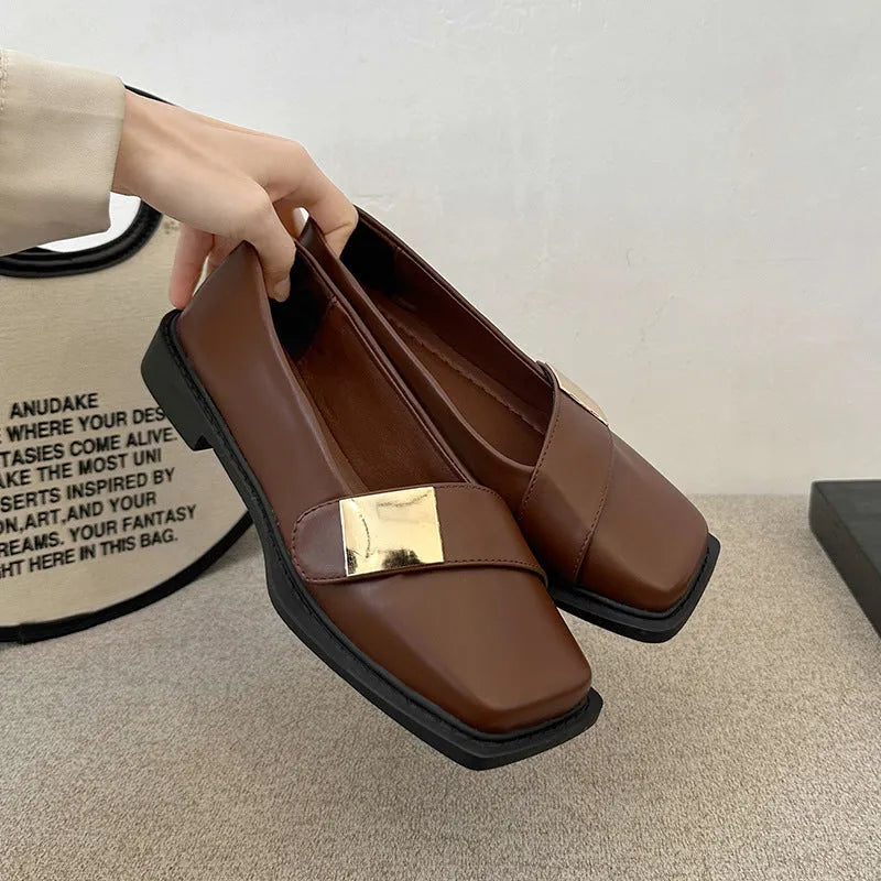 Women's beige artificial leather flat-heeled shoes with square toe and silver metal buckle.