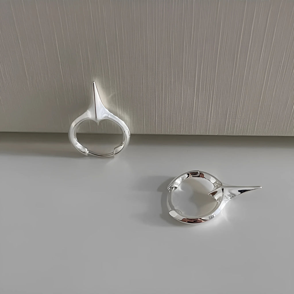 Geometric star-shaped ear clips for women with platinum electroplated finish on copper base