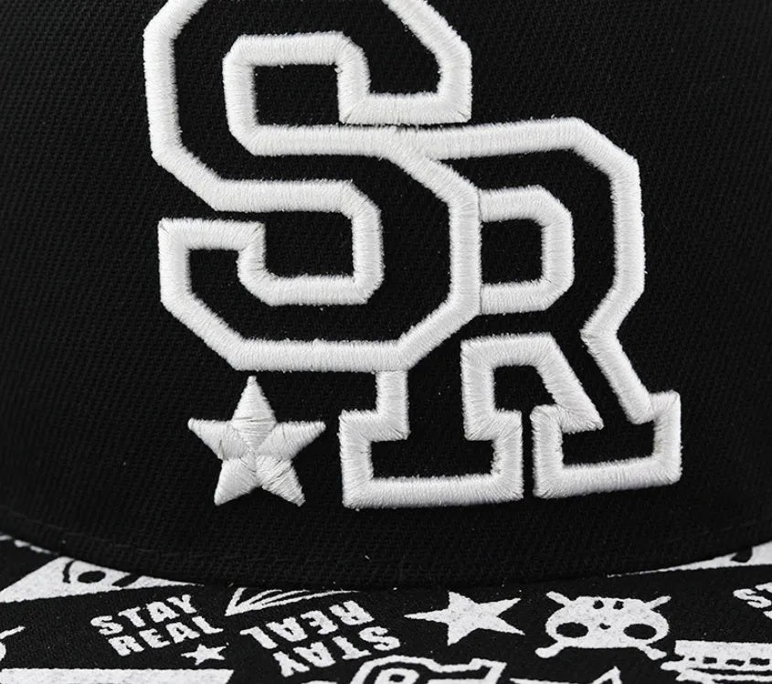 Cotton baseball cap with adjustable strap in black or white, showing embroidered letter detail on the front.