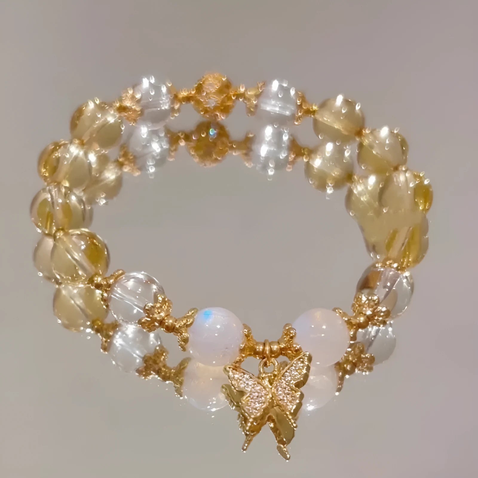 Women's Moonstone White crystal bracelet with diamond-shaped beads and a butterfly charm in Chinese style.