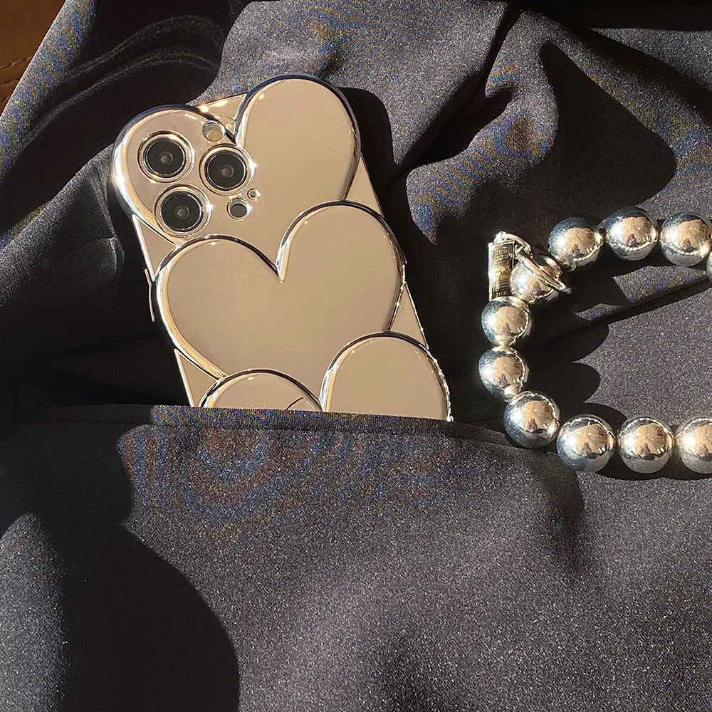 Electroplating love design on a soft TPU iPhone mobile phone case, shown next to a matching bracelet.
