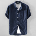 Men's short sleeve loose fit linen shirt in a cotton blend fabric, shown in a solid colour.