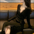 Black women's slim fit woolen skirt with a princess cut silhouette.