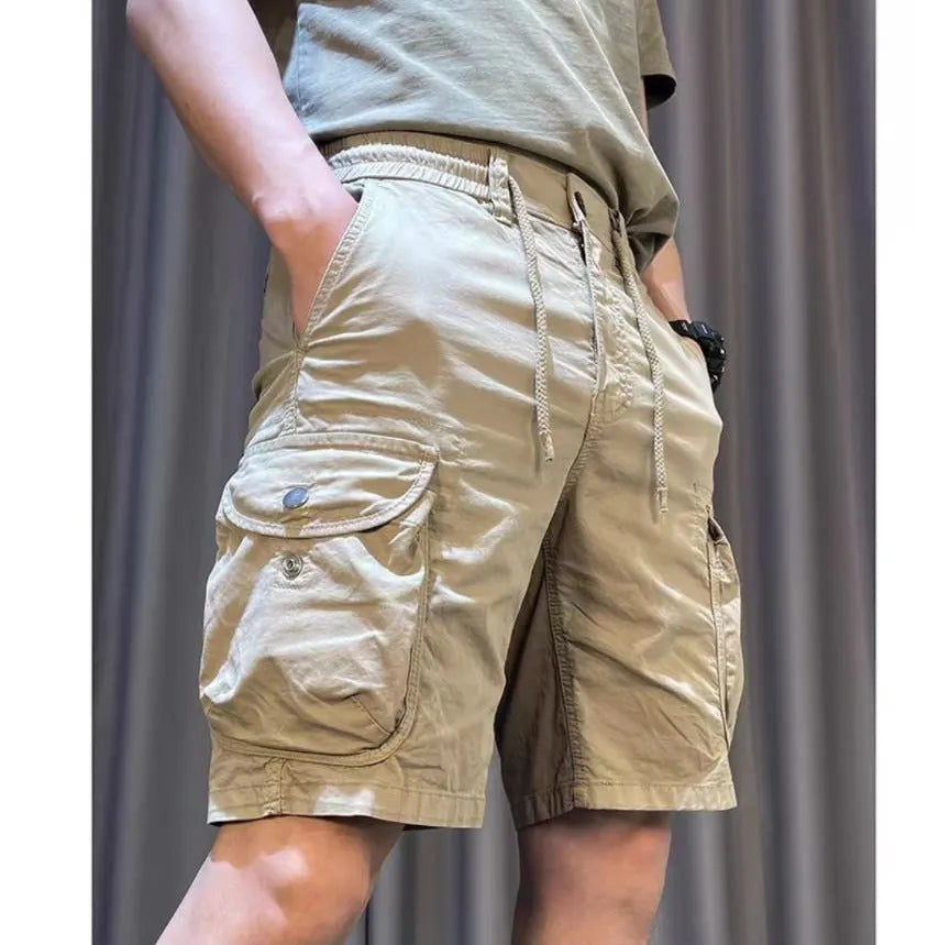 Loose straight-leg multi-pocket overalls in khaki, showing Korean-style casual fit.
