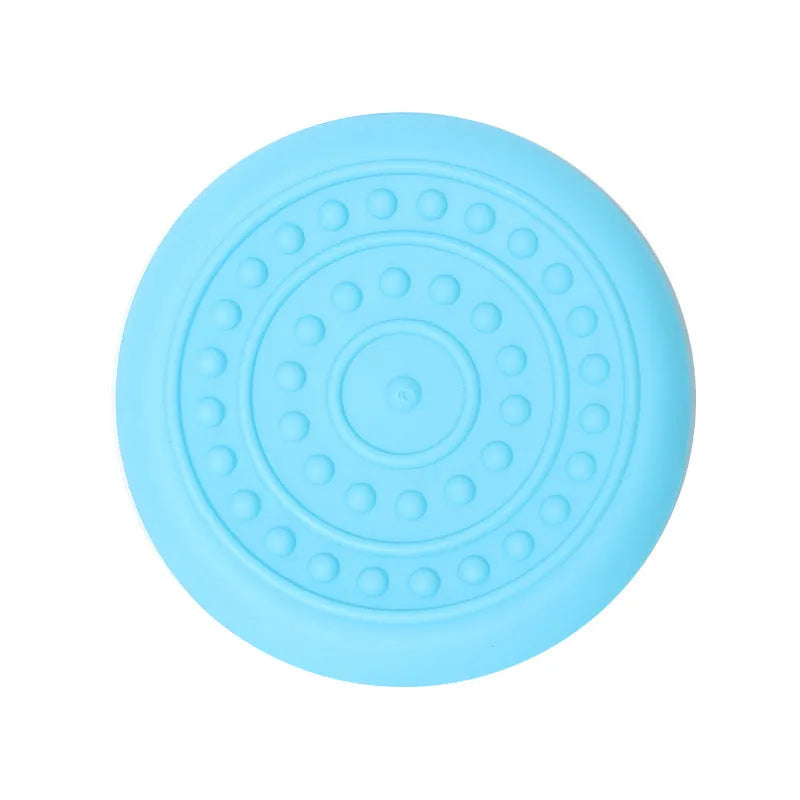 Plastic rubber dog Frisbee pet toy in assorted colours for outdoor fetch games.