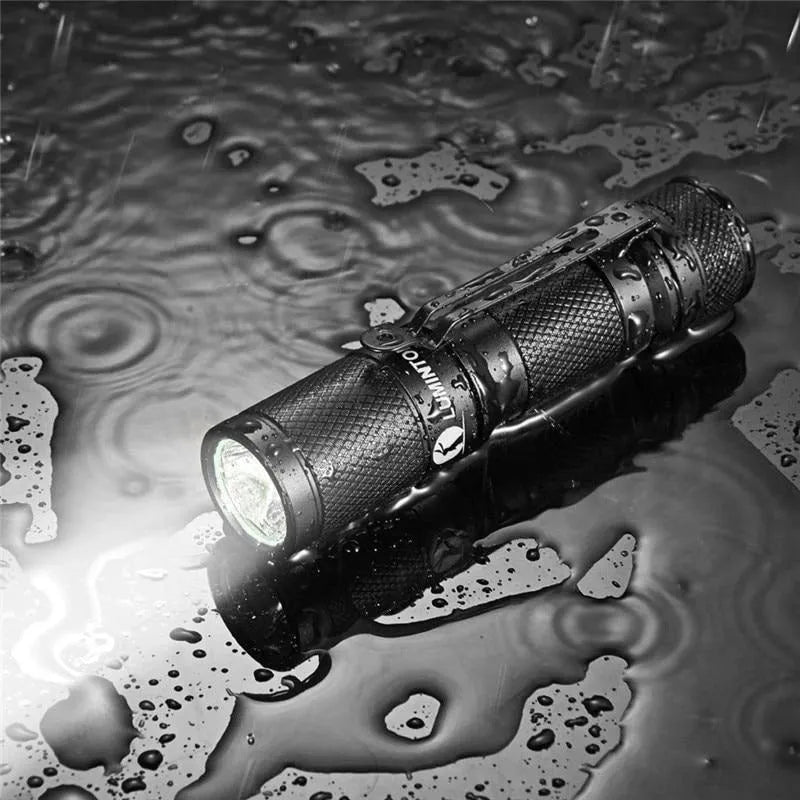 Black Lumintop Tool AA 2.0 compact aluminium flashlight with keychain and magnetic tail cap.