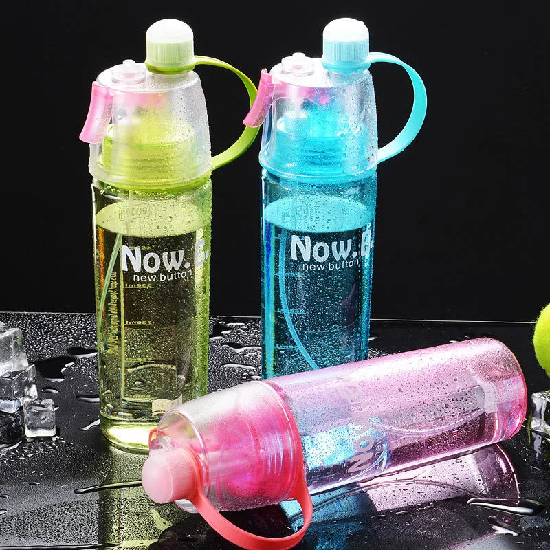 Portable sports mist spray water bottle with transparent body, handle, and mist spray function