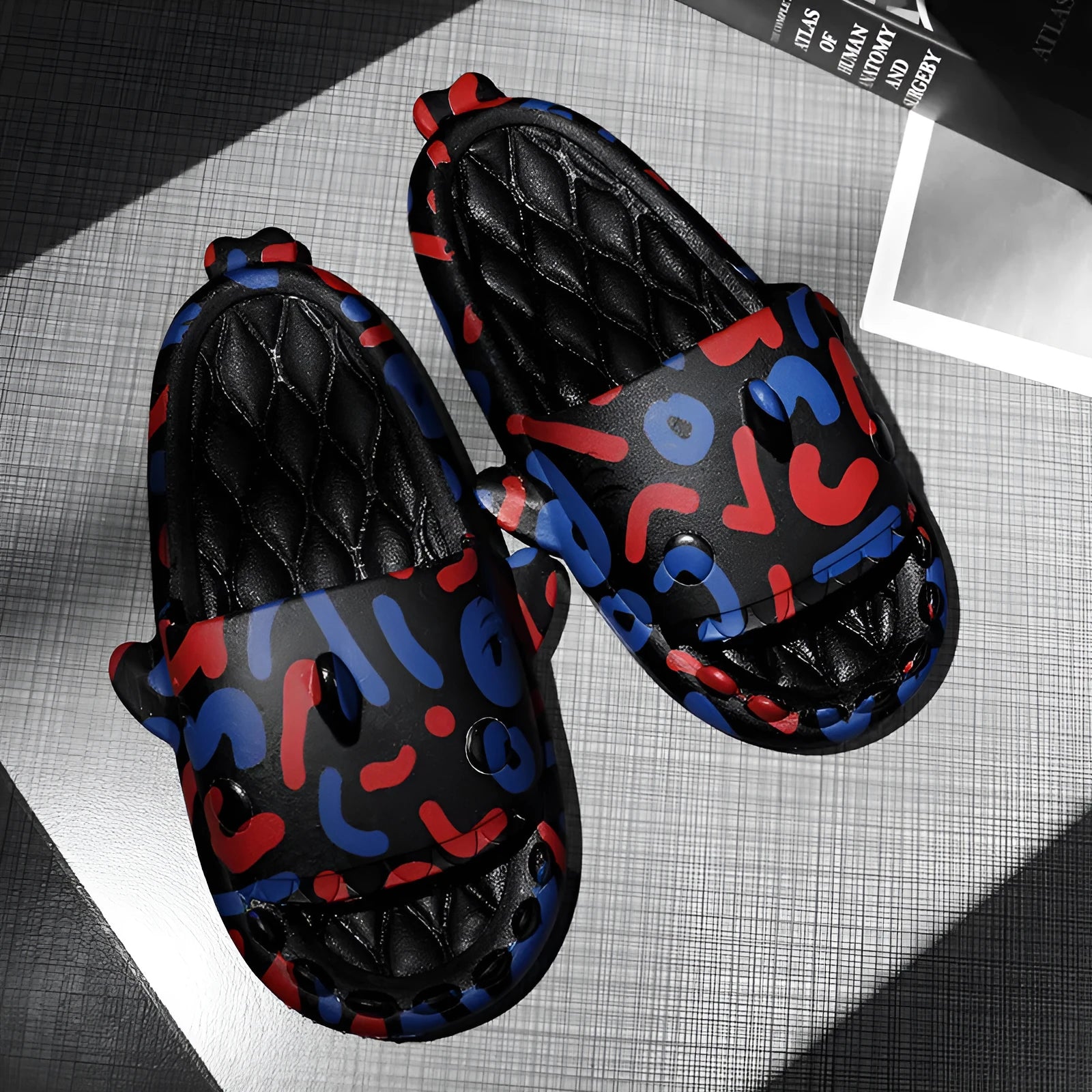 Shark design open-toe EVA slippers in various colours on a white background