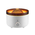 White simulated flame volcano humidifier diffuser with remote control on tabletop