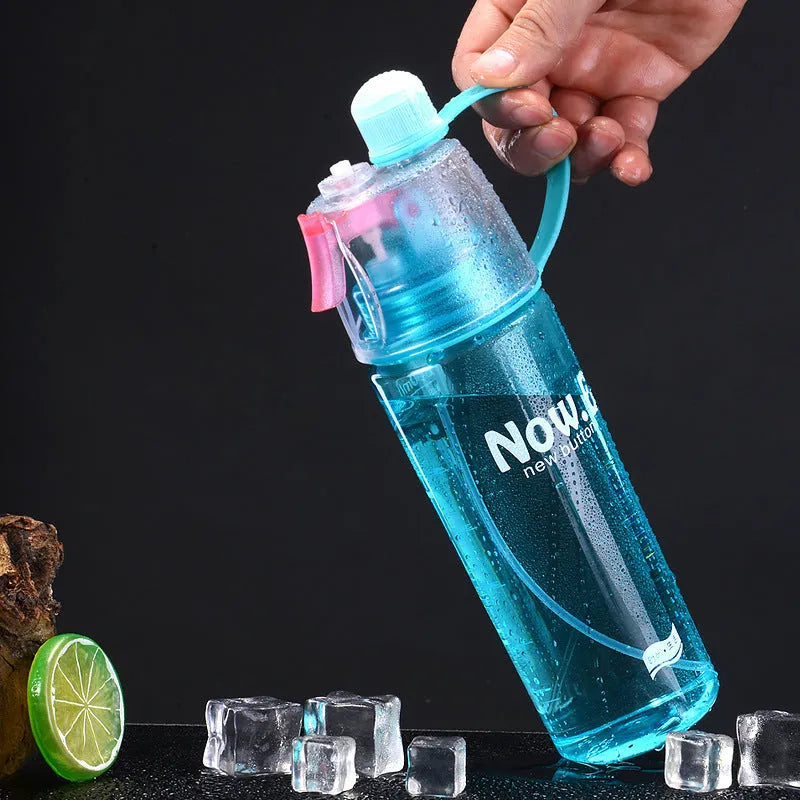 Portable sports mist spray water bottle with transparent body, handle, and mist spray function