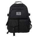Black and white soft nylon student backpack with laptop compartment and three-dimensional pockets