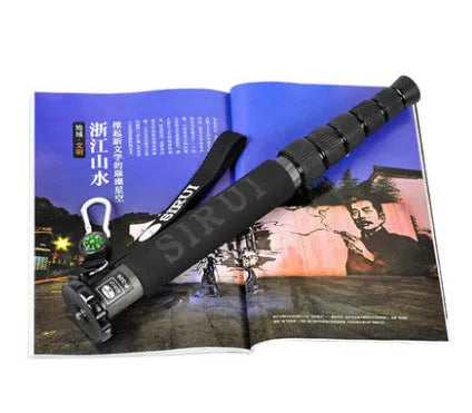 Black carbon fibre telescopic monopod for DSLR cameras extended to full height