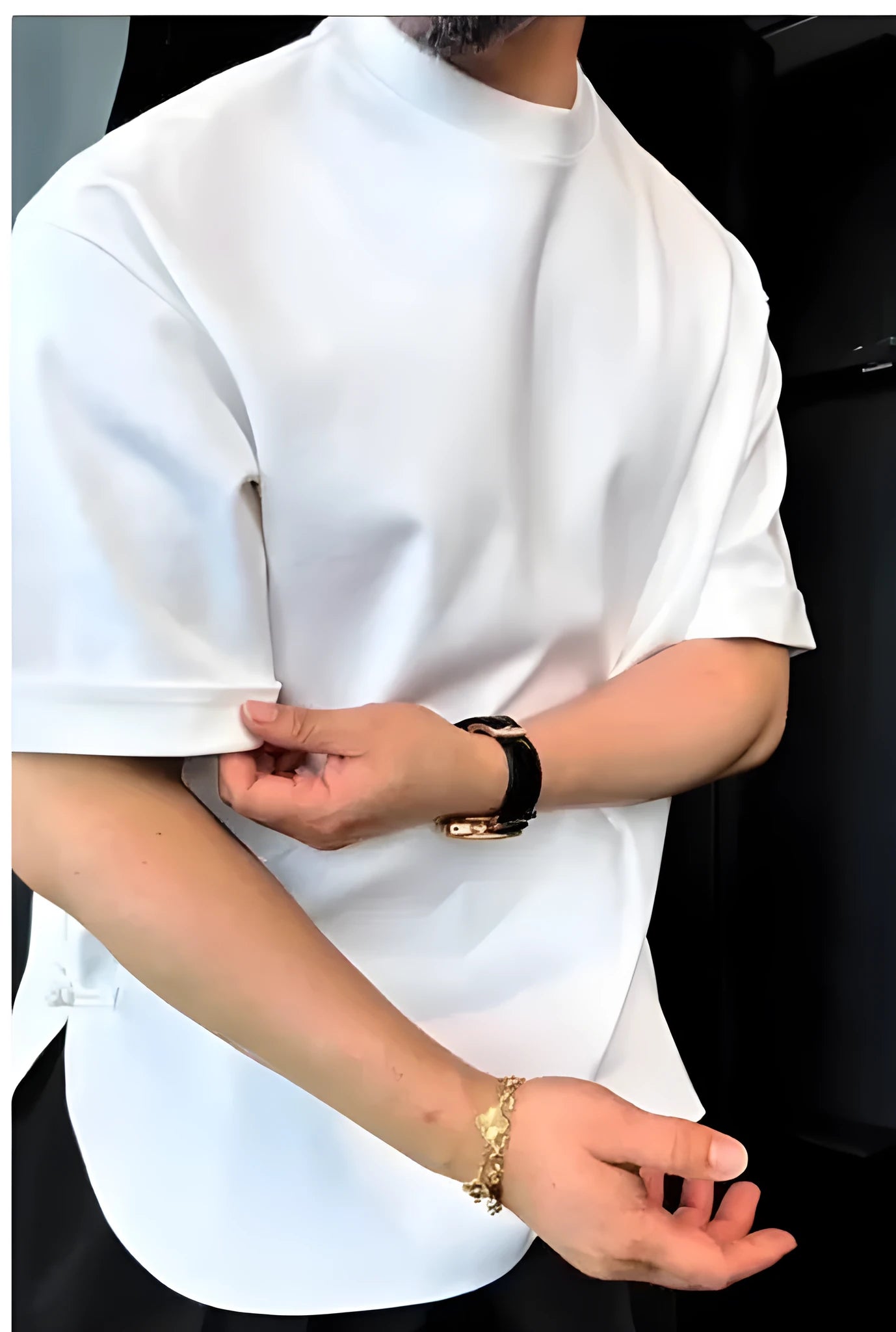White men's t-shirt with a buttoned round hem and short sleeves.
