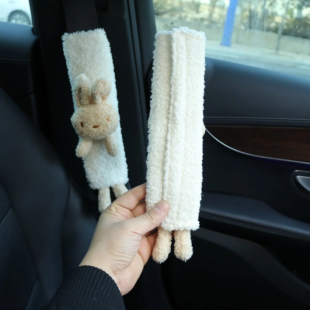 Cartoon plush lamb wool car seat belt shoulder protector in bear and rabbit designs.