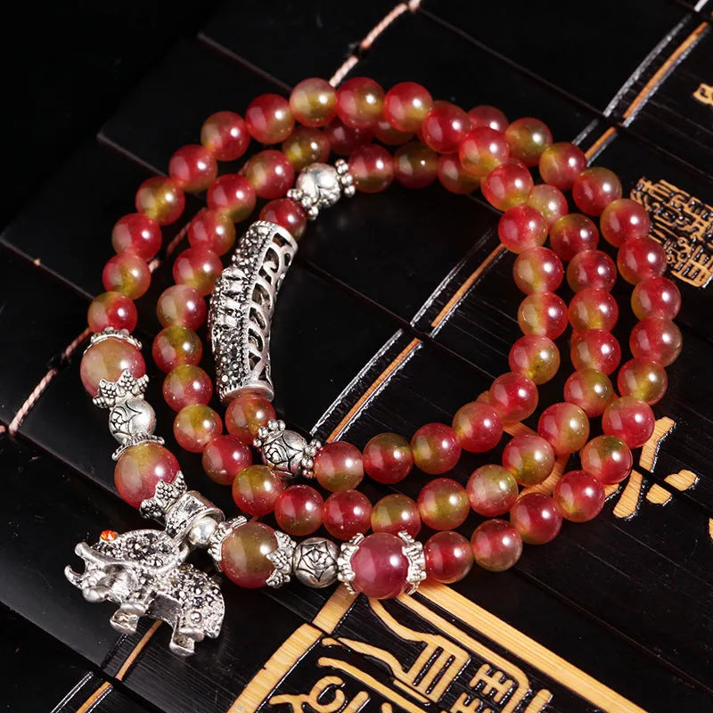 Watermelon crystal Chinese knot bracelet showing traditional design and natural crystal material