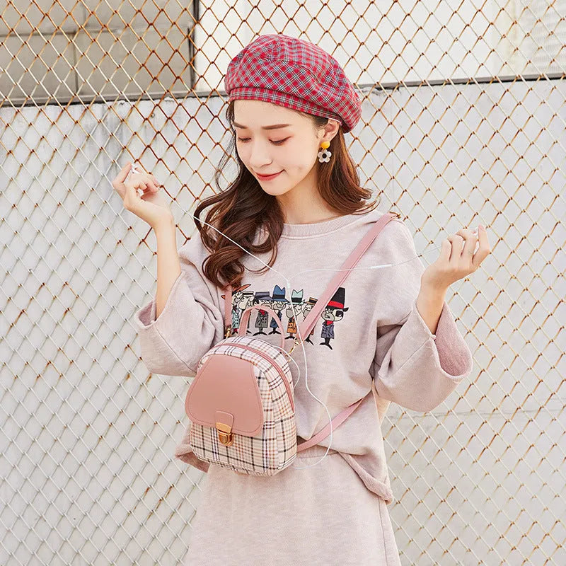 A one shoulder diagonal phone bag in PU material, shown in one of five colour options.