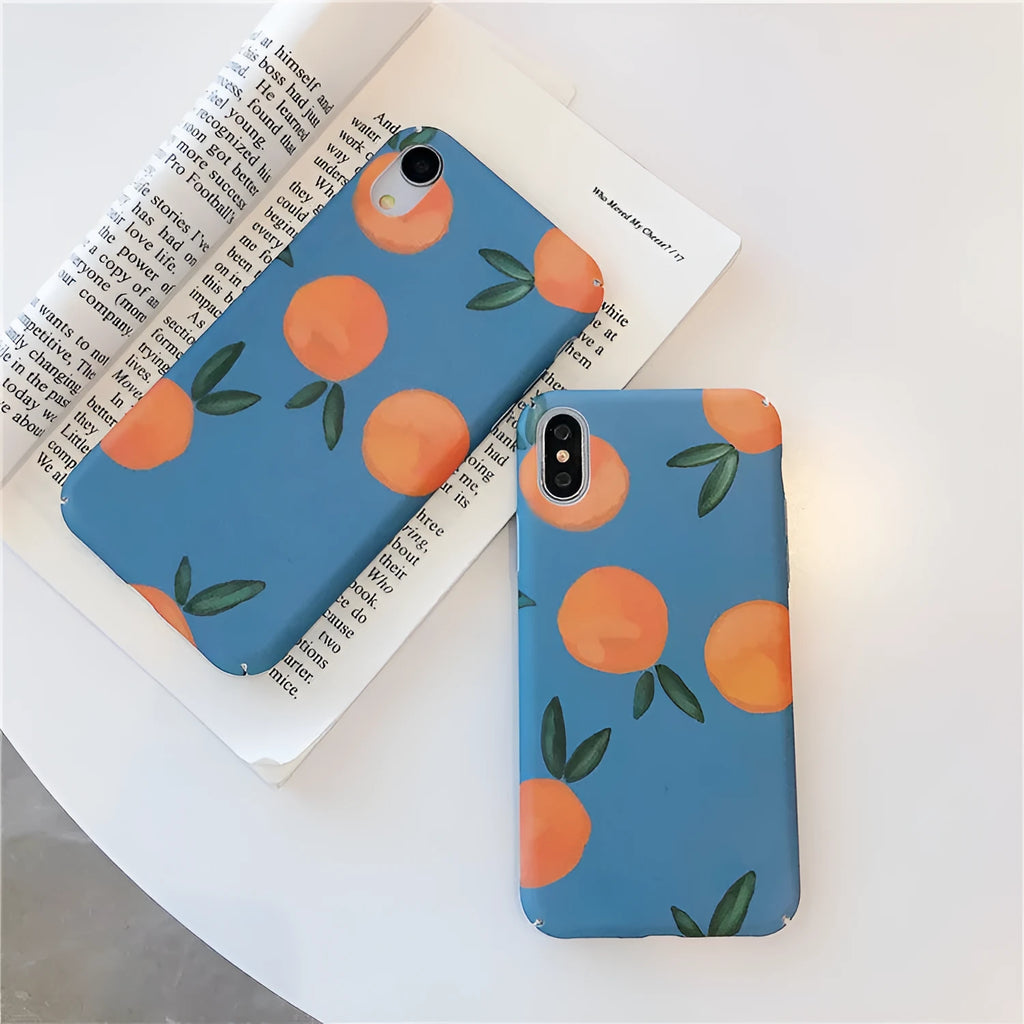 Orange and blue retro design plastic back cover case for iPhone on a table.