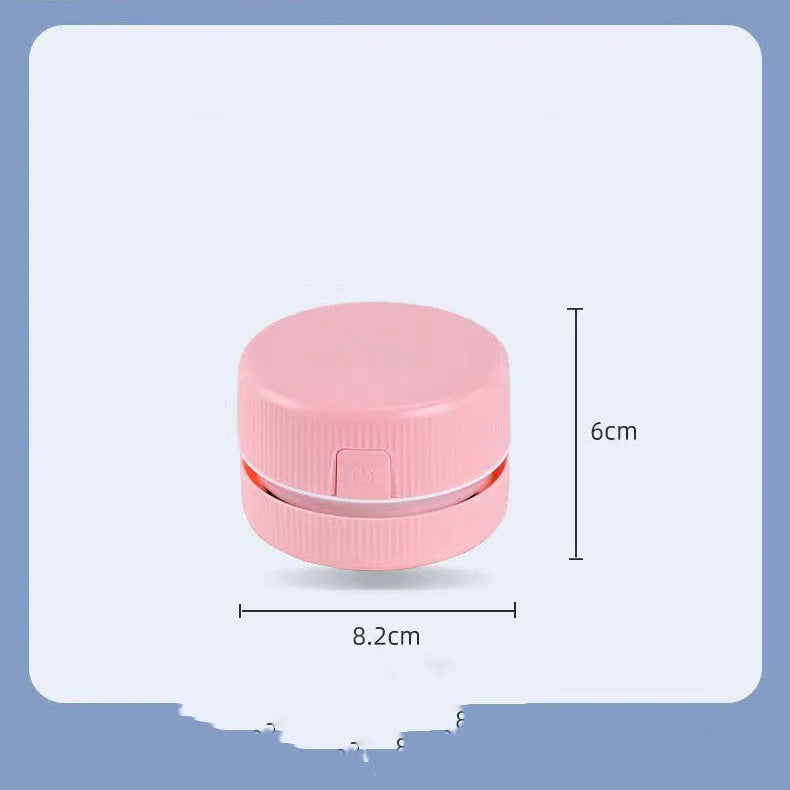 Portable mini desktop vacuum cleaner in blue and pink colour options with rechargeable battery