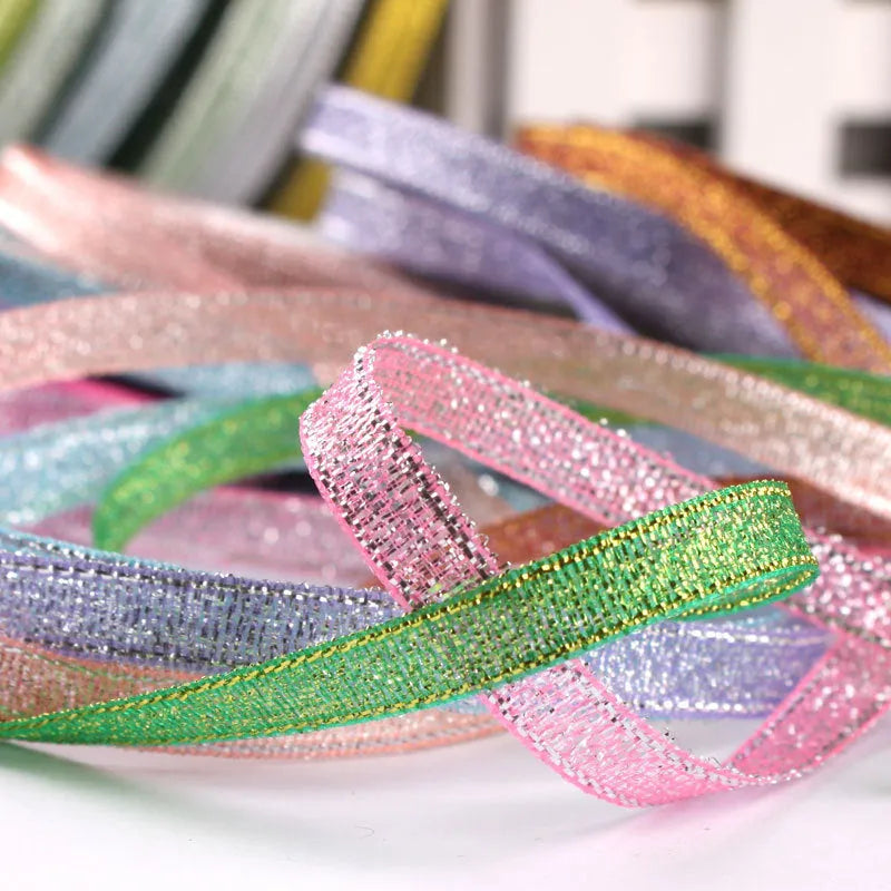 Roll of 0.6cm wide polyester gift packaging ribbon in a choice of 22 colours including gold leaf and jade pink.