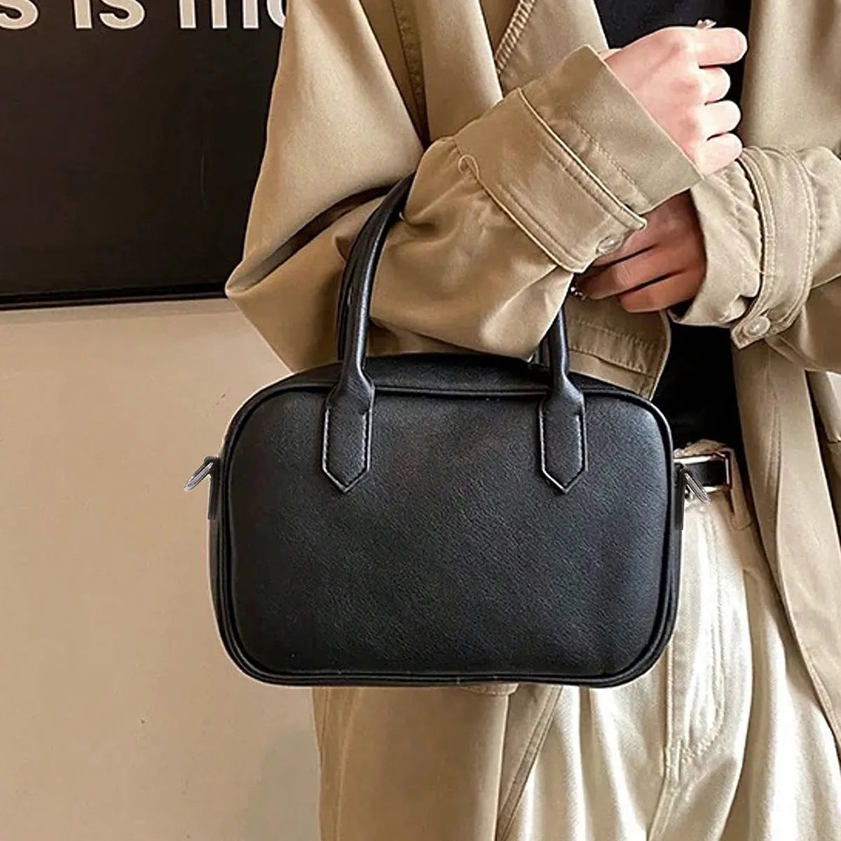 Retro horizontal square black PU leather messenger bag with a single shoulder strap