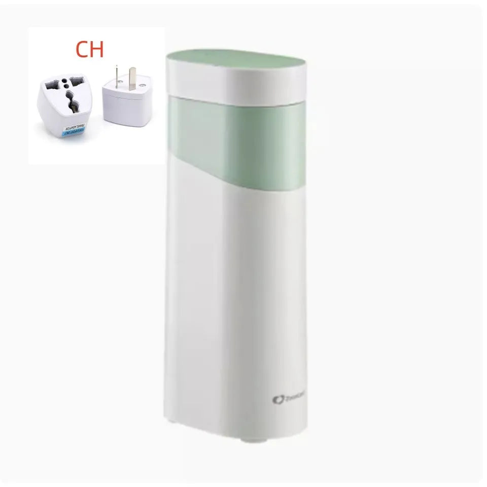Black and green compact desktop instant water dispenser with digital display on a wooden desk.
