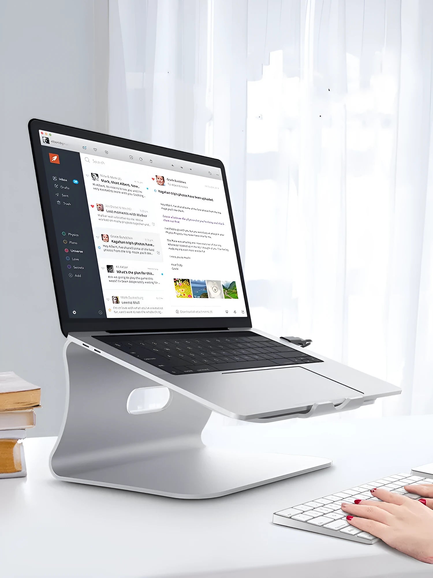 Aluminium alloy notebook cooling stand in silver or grey with rotary adjustment.