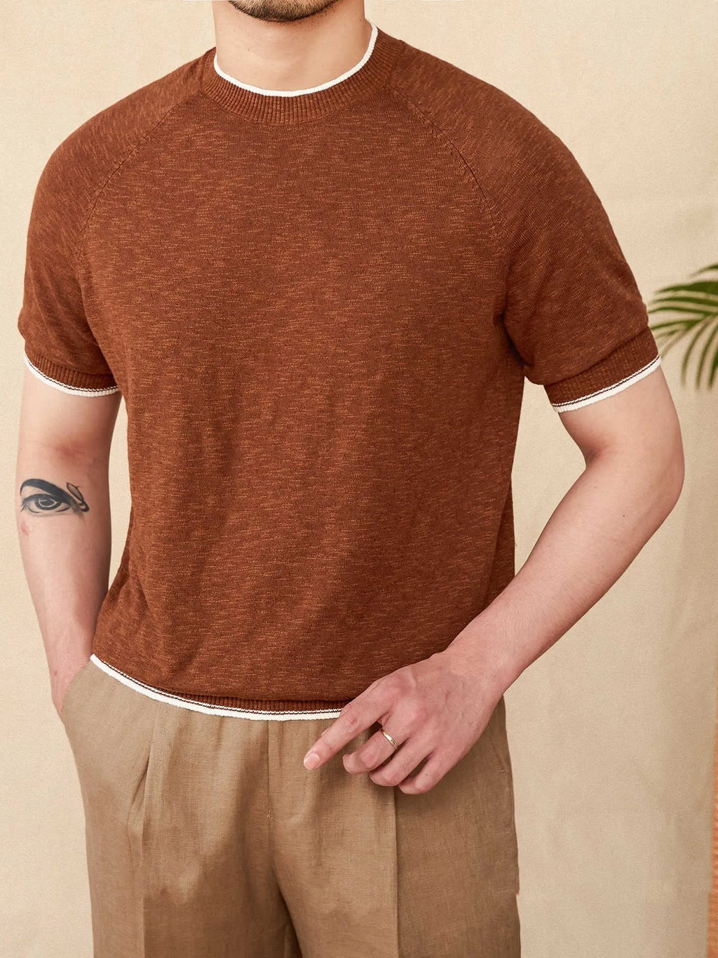 Brown linen cotton casual t-shirt with round neck and short sleeves laid flat
