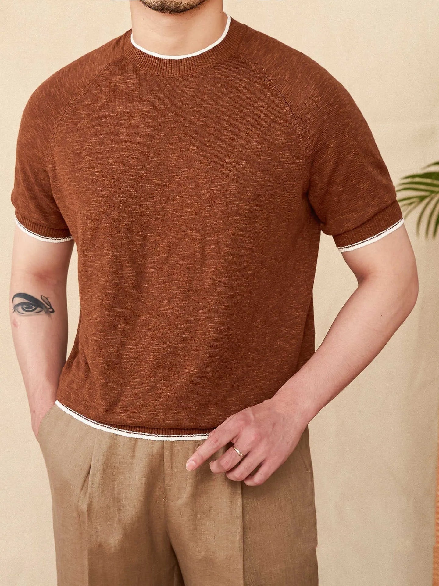 Brown linen cotton casual t-shirt with round neck and short sleeves laid flat