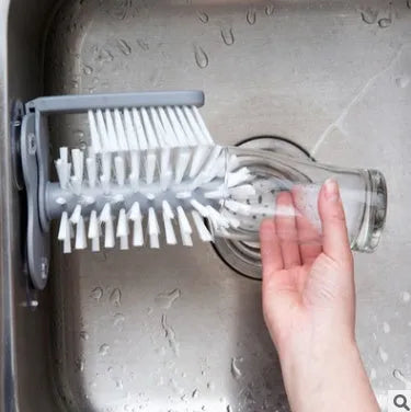Grey double-head rotating cup brush with suction cups for wall mounting, length 17.5cm.