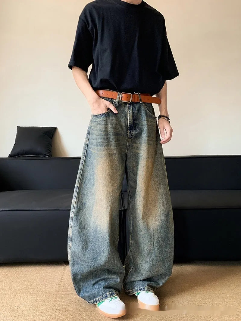 Retro blue distressed men's jeans with wide leg fit and micro elastic cotton blend fabric