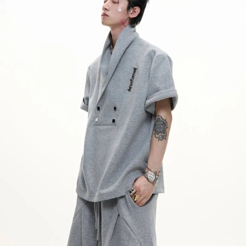 Men's dark grey metal embellished sports suit with V-neck jacket and shorts on a hanger
