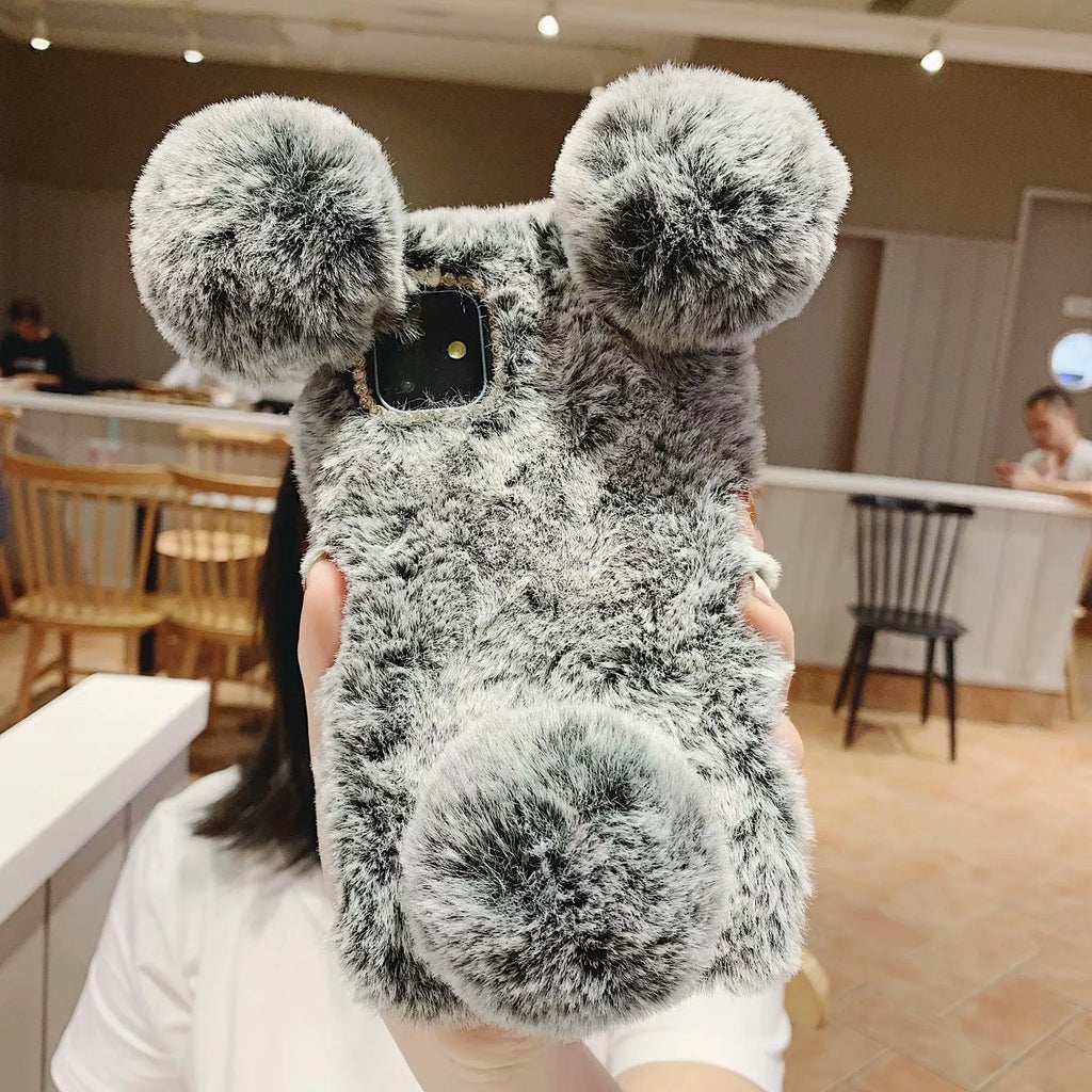 Bear design plush protective TPU back case for Apple iPhone on a grey background.