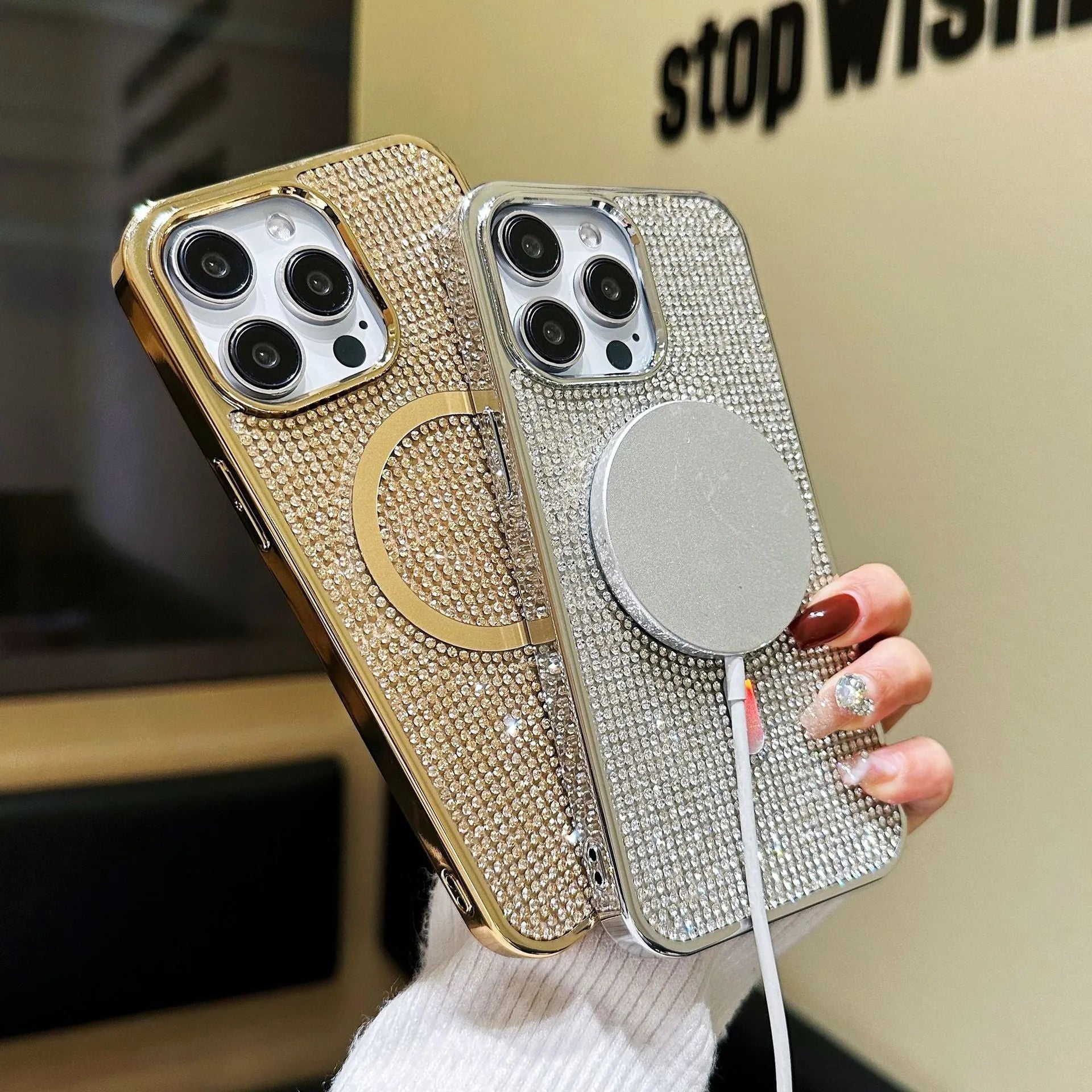 Rhinestone electroplating TPU phone case with diamond magnetic suction on a black iPhone model
