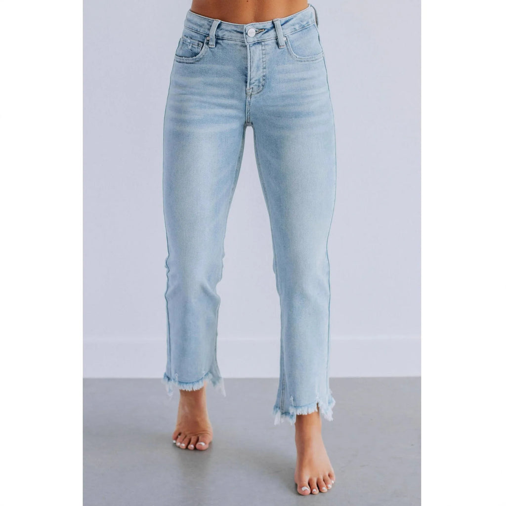 Women's solid colour denim trousers with hand-distressed detailing in dark blue wash