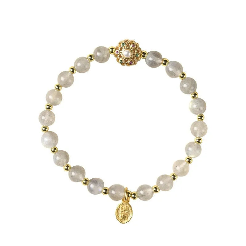 Gray moonstone and pink sunstone crystal bracelet with hand-woven cord and peach blossom quartz charms.